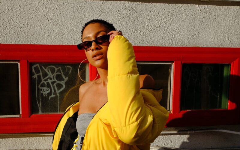 woman holding her sunglasses