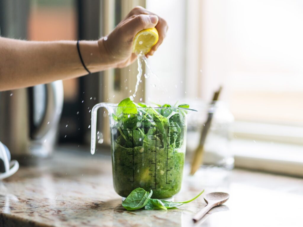 person squeezing lemon